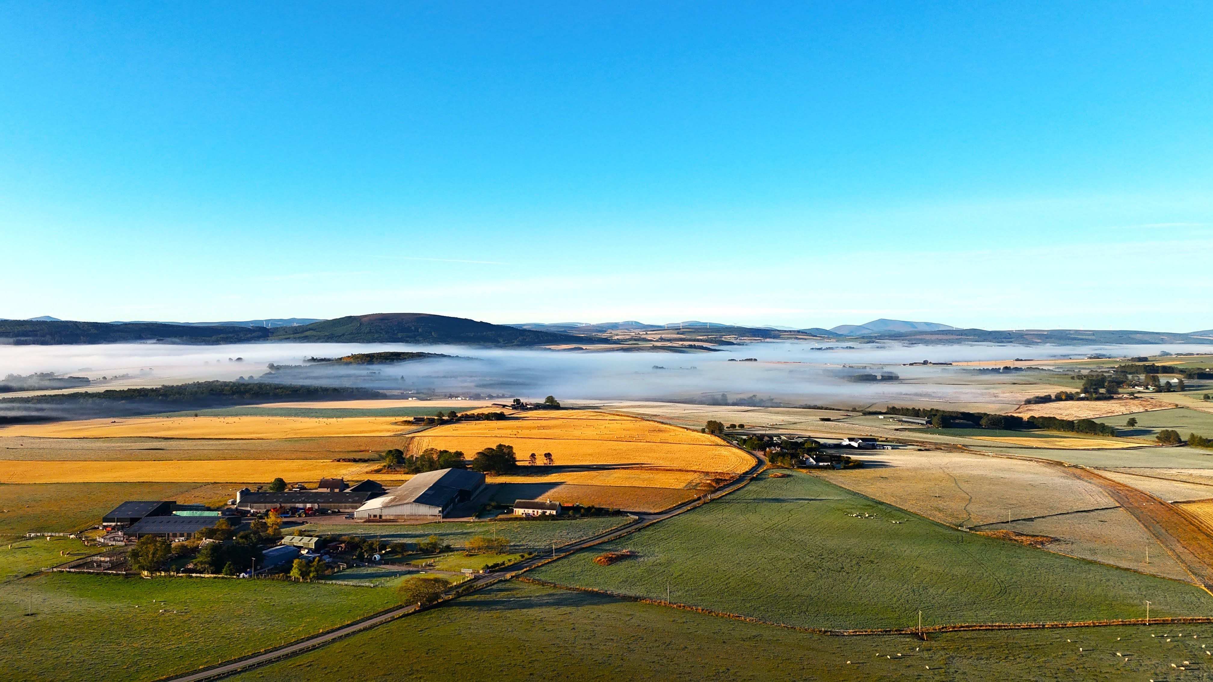 Morning mist over farmland outside Keith, looking south towards Leith Farm